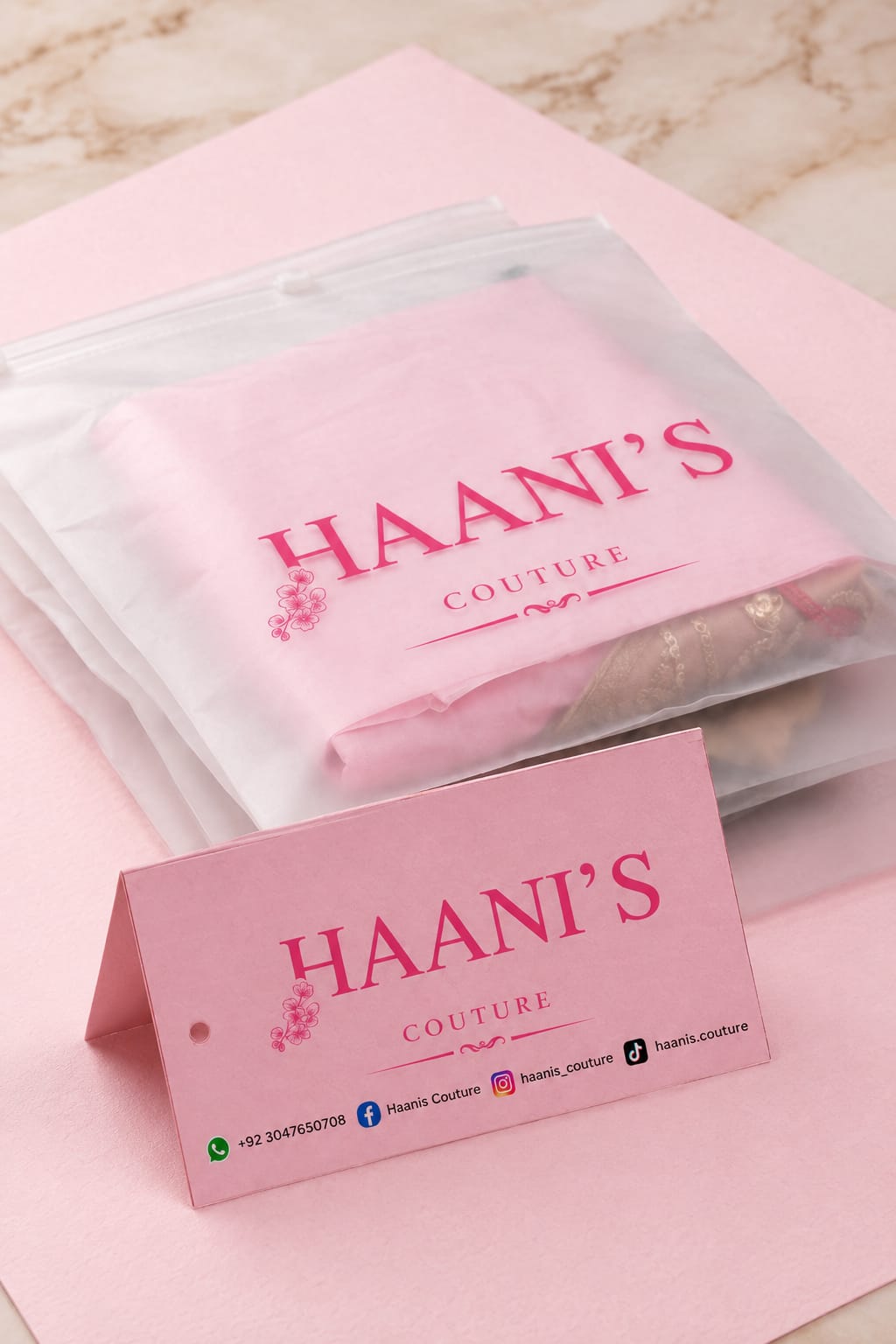 An order from Haani's Couture, wrapped in branded tissue with a Haani's Couture hang tag